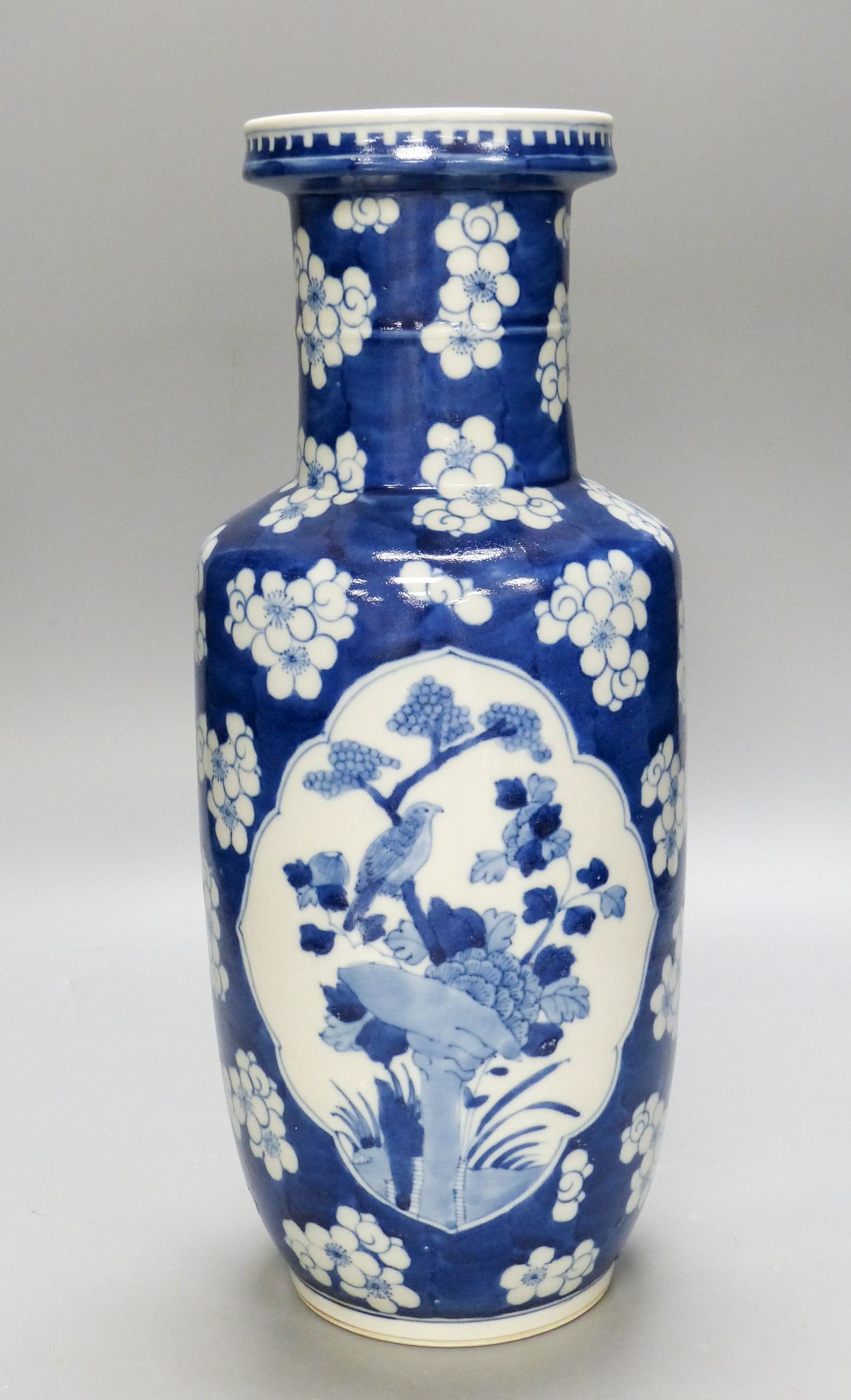 A Chinese blue and white ‘prunus’ rouleau vase, 35cm